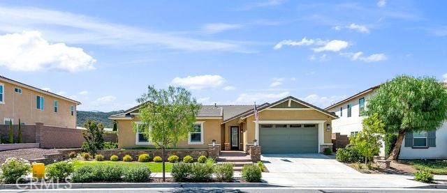 33303 Barmetta Ln, Temecula, CA 92592 - view of front of property featuring a garage, concrete driveway, and stucco siding