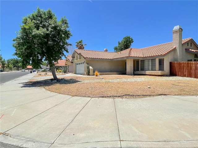37543 Royal Ct, Palmdale, CA 93552 - single story home with an attached garage, a tiled roof, and stucco siding