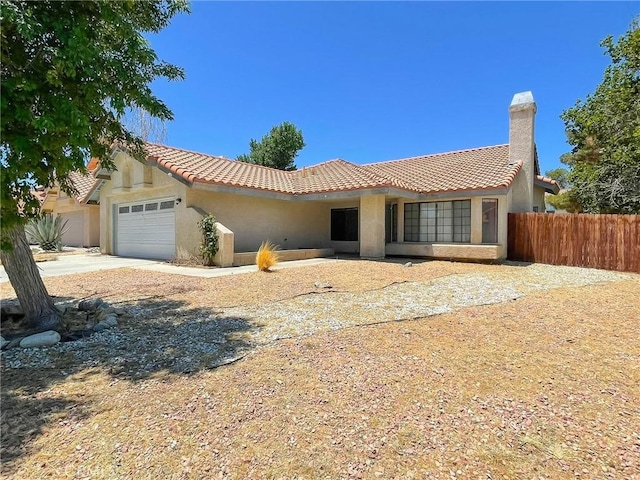 37543 Royal Ct, Palmdale, CA 93552 - view of front facade with a tiled roof, a garage, stucco siding, and a chimney