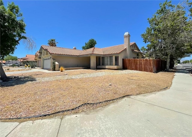 37543 Royal Ct, Palmdale, CA 93552 - ranch-style home featuring an attached garage, a tile roof, and stucco siding