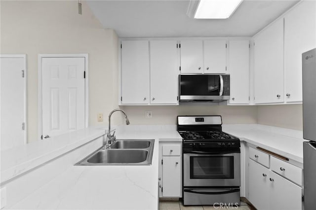 18752 Mandan St Unit 1016, Canyon Country, CA 91351 - kitchen featuring stainless steel appliances, white cabinetry, and light countertops