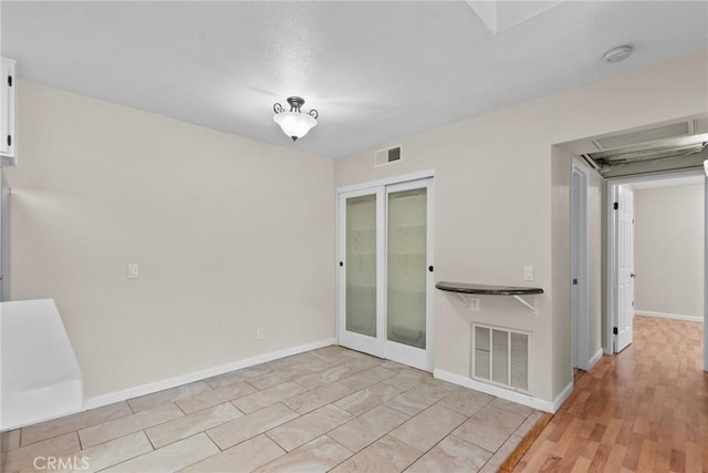 18752 Mandan St Unit 1016, Canyon Country, CA 91351 - spare room featuring french doors and a smoke detector