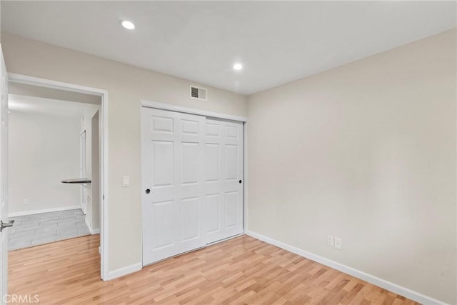 18752 Mandan St Unit 1016, Canyon Country, CA 91351 - unfurnished bedroom featuring light wood-style flooring, recessed lighting, and a closet