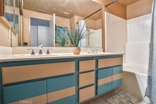 7331 Belpine Pl Unit 31, Rancho Cucamonga, CA 91730 - bathroom featuring double vanity, shower / tub combo with curtain, and tile patterned floors