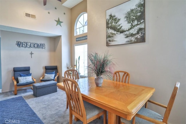 7331 Belpine Pl Unit 31, Rancho Cucamonga, CA 91730 - dining room with a ceiling fan, carpet, and a high ceiling