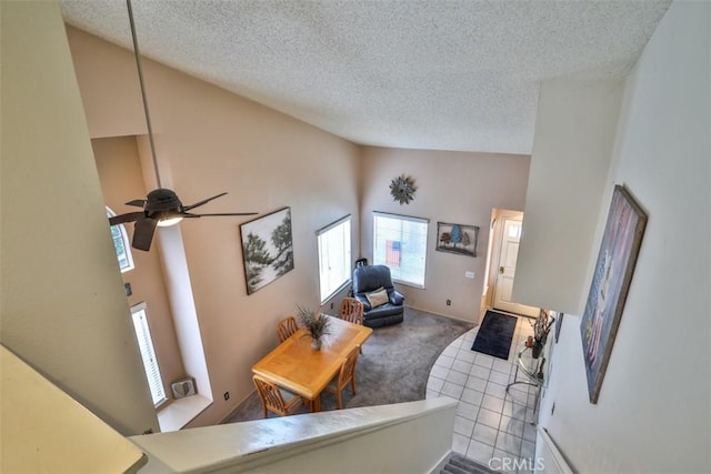7331 Belpine Pl Unit 31, Rancho Cucamonga, CA 91730 - carpeted living area with high vaulted ceiling, a textured ceiling, and a ceiling fan