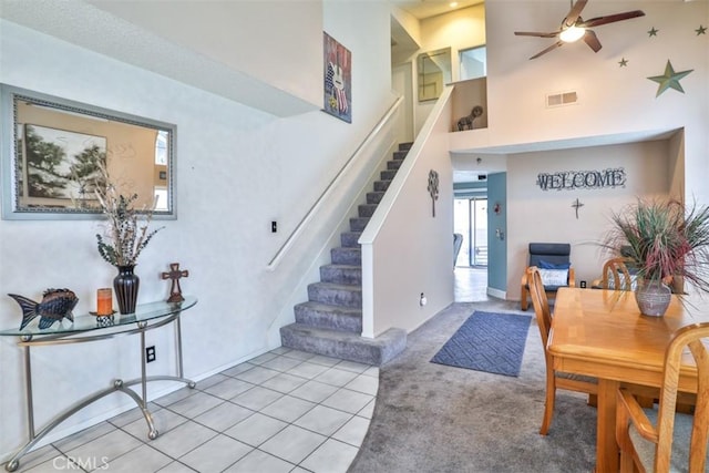 7331 Belpine Pl Unit 31, Rancho Cucamonga, CA 91730 - dining space with stairway, ceiling fan, a high ceiling, and light tile patterned flooring