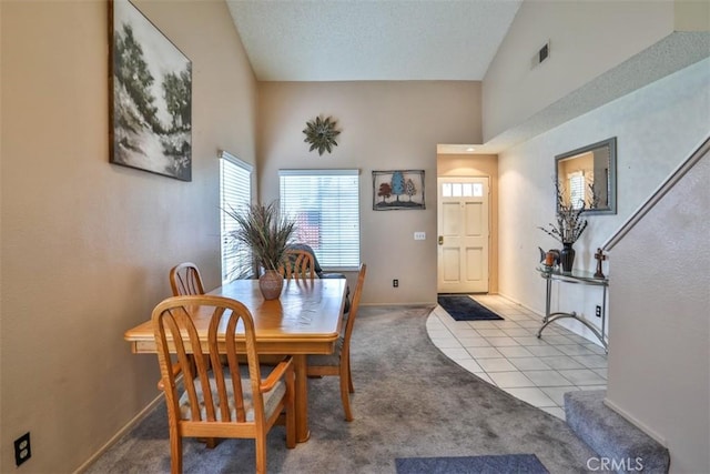 7331 Belpine Pl Unit 31, Rancho Cucamonga, CA 91730 - carpeted dining area with baseboards and tile patterned floors