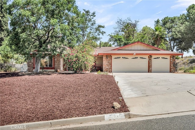 1239 Highridge St, Riverside, CA 92506 - view of front facade with an attached garage, driveway, and brick siding