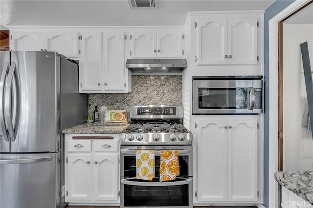 1239 Highridge St, Riverside, CA 92506 - kitchen featuring appliances with stainless steel finishes, exhaust hood, decorative backsplash, and white cabinetry