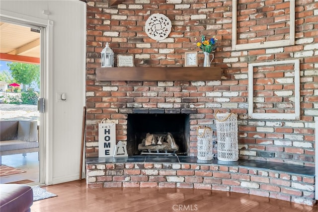 1239 Highridge St, Riverside, CA 92506 - detailed view of wood finished floors and a brick fireplace