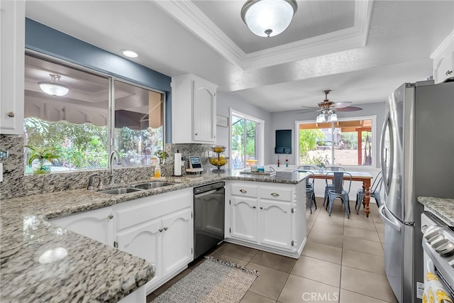 1239 Highridge St, Riverside, CA 92506 - kitchen with dishwasher, freestanding refrigerator, a raised ceiling, decorative backsplash, and white cabinets