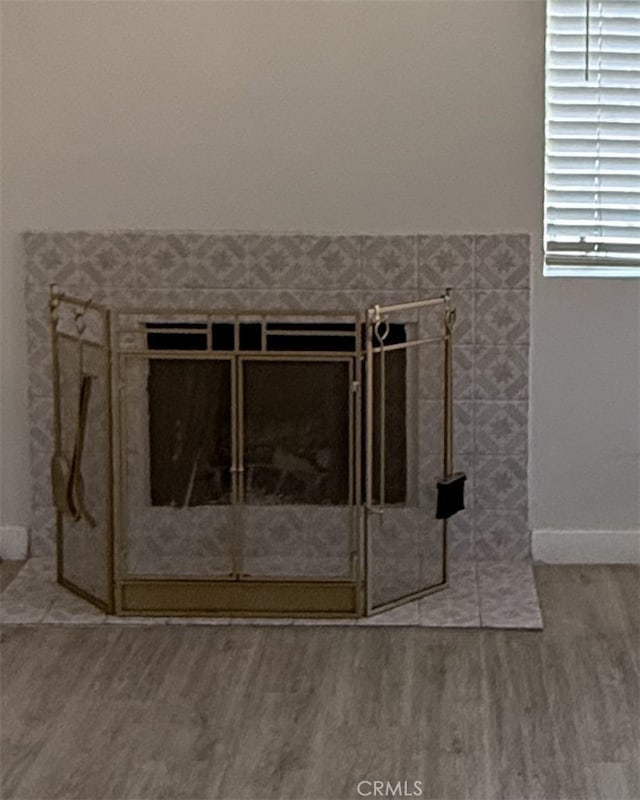 16600 Seville Ave Unit F, Fontana, CA 92335 - detailed view of wood finished floors and baseboards