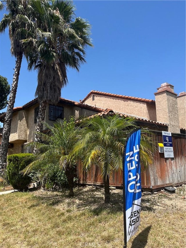 16600 Seville Ave Unit F, Fontana, CA 92335 - exterior space featuring a tile roof and stucco siding