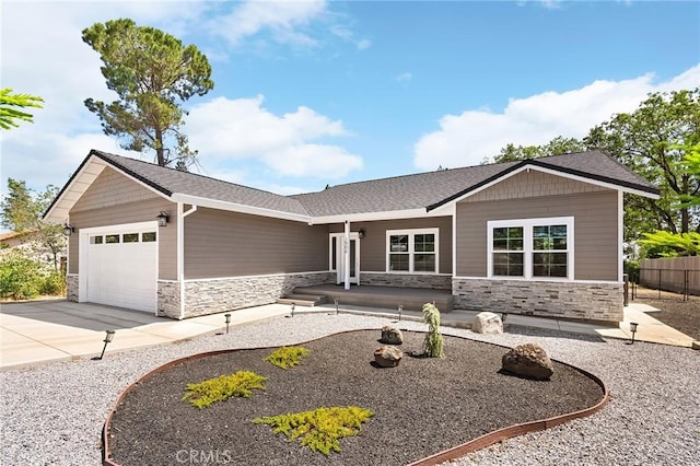 1906 Crandall Way, Paradise, CA 95969 - ranch-style home with stone siding, an attached garage, driveway, and a shingled roof