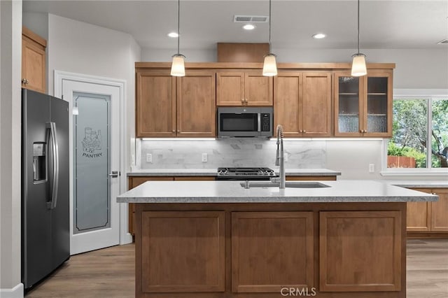 1906 Crandall Way, Paradise, CA 95969 - kitchen featuring stainless steel appliances, light wood-style floors, light countertops, decorative backsplash, and recessed lighting