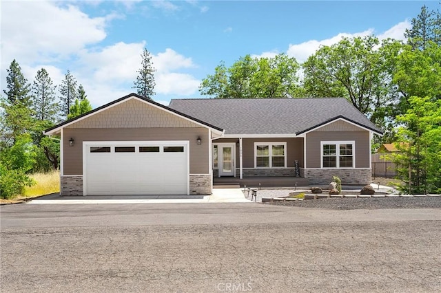 1906 Crandall Way, Paradise, CA 95969 - view of front of property with stone siding, a garage, and driveway