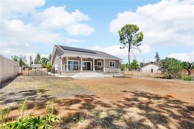 1906 Crandall Way, Paradise, CA 95969 - back of house with ceiling fan, solar panels, a fenced backyard, a gate, and a patio area