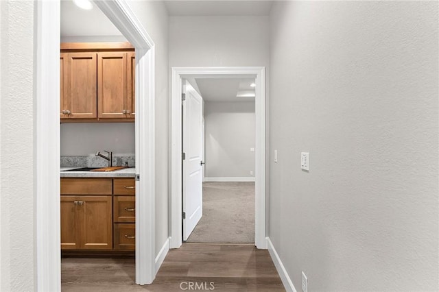 1906 Crandall Way, Paradise, CA 95969 - corridor featuring a sink and wood finished floors