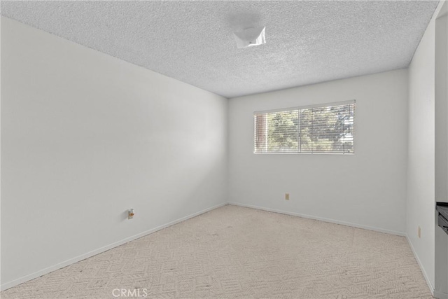1529 Pomeroy Rd, Arroyo Grande, CA 93420 - carpeted empty room featuring a textured ceiling and baseboards