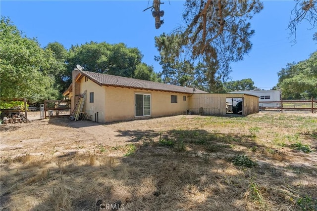 1529 Pomeroy Rd, Arroyo Grande, CA 93420 - back of house featuring stucco siding, a tiled roof, and a chimney