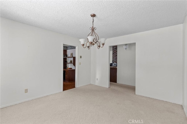 1529 Pomeroy Rd, Arroyo Grande, CA 93420 - spare room featuring light colored carpet, a chandelier, and a textured ceiling