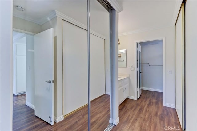2391 Via Mariposa W Unit 2E, Laguna Woods, CA 92637 - hallway with ornamental molding and dark wood-style floors