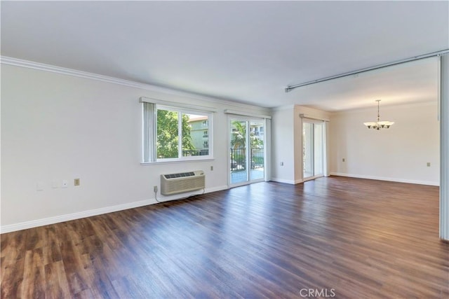 2391 Via Mariposa W Unit 2E, Laguna Woods, CA 92637 - unfurnished living room with a chandelier, a wall mounted AC, crown molding, and dark wood finished floors