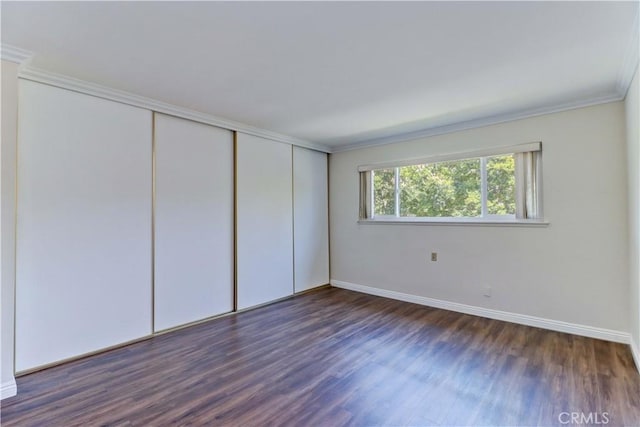 2391 Via Mariposa W Unit 2E, Laguna Woods, CA 92637 - unfurnished bedroom featuring ornamental molding, wood finished floors, and a closet