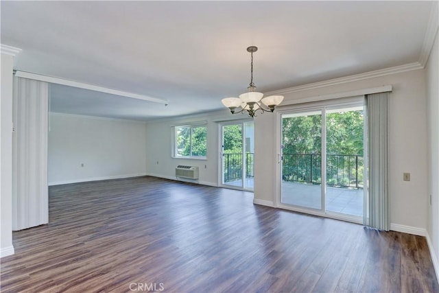 2391 Via Mariposa W Unit 2E, Laguna Woods, CA 92637 - spare room featuring a chandelier, dark wood finished floors, an AC wall unit, and ornamental molding