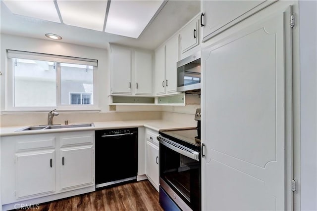 2391 Via Mariposa W Unit 2E, Laguna Woods, CA 92637 - kitchen with stainless steel appliances, recessed lighting, dark wood-style flooring, white cabinetry, and light countertops