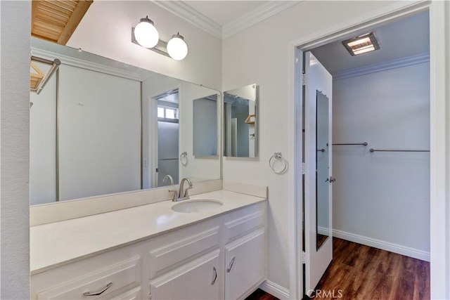 2391 Via Mariposa W Unit 2E, Laguna Woods, CA 92637 - bathroom with crown molding, vanity, and wood finished floors