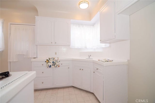 251 W 112th St, Los Angeles, CA 90061 - kitchen with white cabinets and light countertops