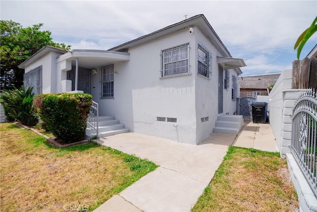 251 W 112th St, Los Angeles, CA 90061 - view of front of house featuring crawl space and stucco siding