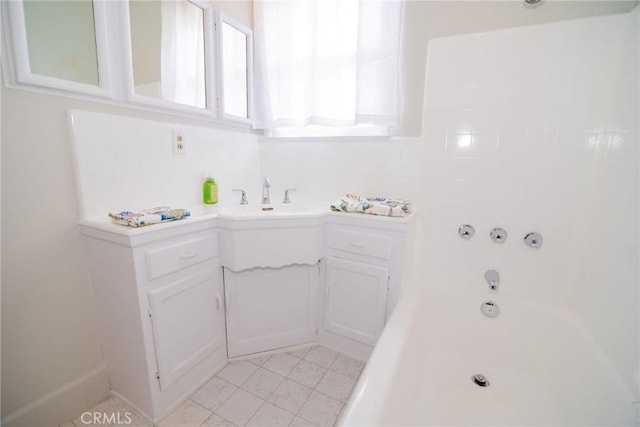 251 W 112th St, Los Angeles, CA 90061 - bathroom featuring tile patterned floors and vanity