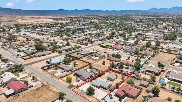 7720 Windsor Ave, Hesperia, CA 92345 - aerial view of property's location featuring a mountain backdrop and property boundaries highlighted