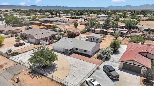 7720 Windsor Ave, Hesperia, CA 92345 - aerial perspective of suburban area featuring a mountainous background