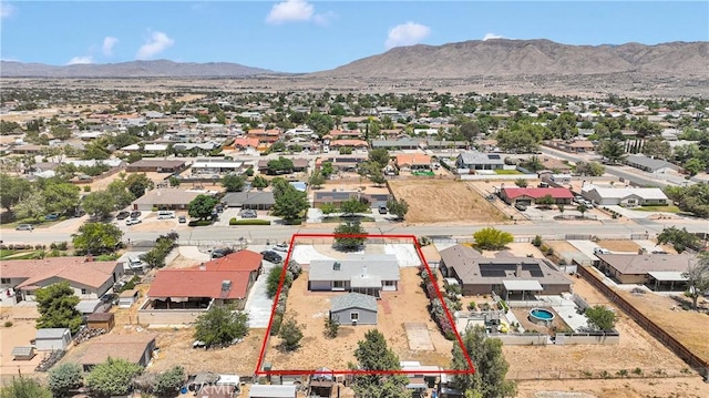 7720 Windsor Ave, Hesperia, CA 92345 - aerial perspective of suburban area featuring a mountain backdrop and property boundaries highlighted