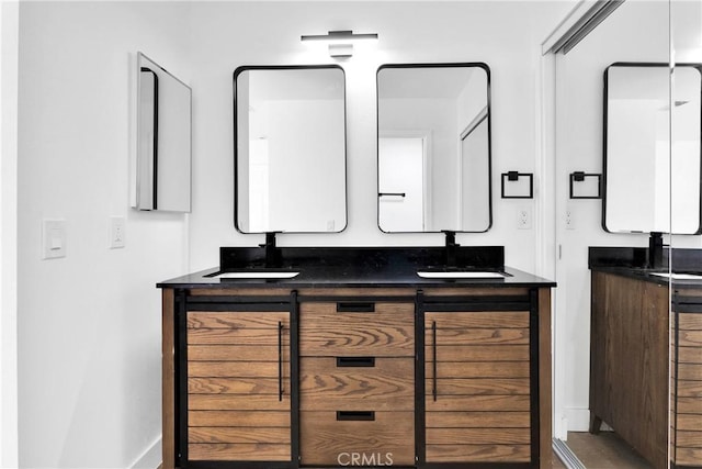 7720 Windsor Ave, Hesperia, CA 92345 - bathroom with double vanity and baseboards