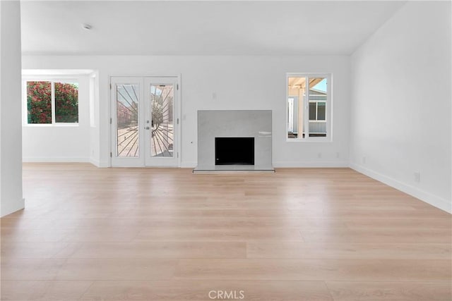 7720 Windsor Ave, Hesperia, CA 92345 - unfurnished living room with light wood finished floors and a fireplace with raised hearth