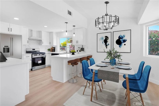 7720 Windsor Ave, Hesperia, CA 92345 - dining space featuring light wood-style flooring, a chandelier, and recessed lighting