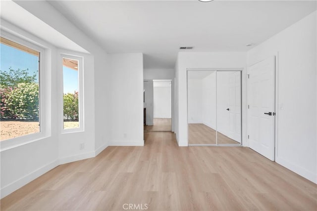 7720 Windsor Ave, Hesperia, CA 92345 - unfurnished bedroom with light wood finished floors and baseboards