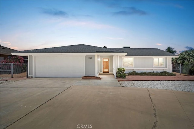 7720 Windsor Ave, Hesperia, CA 92345 - ranch-style home with a garage, driveway, and a shingled roof