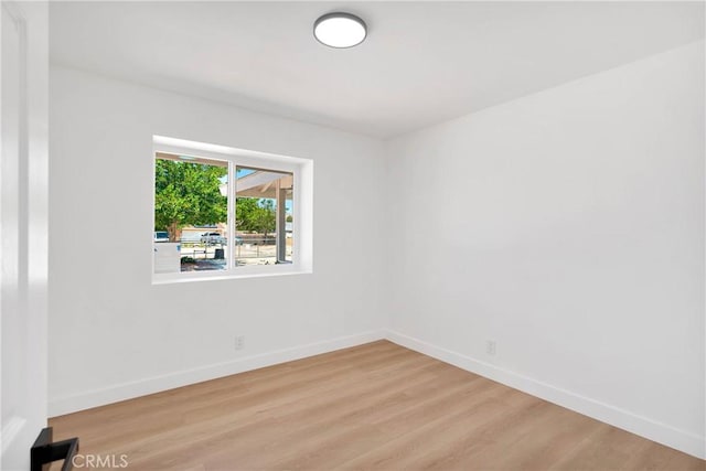 7720 Windsor Ave, Hesperia, CA 92345 - unfurnished room featuring wood finished floors and baseboards