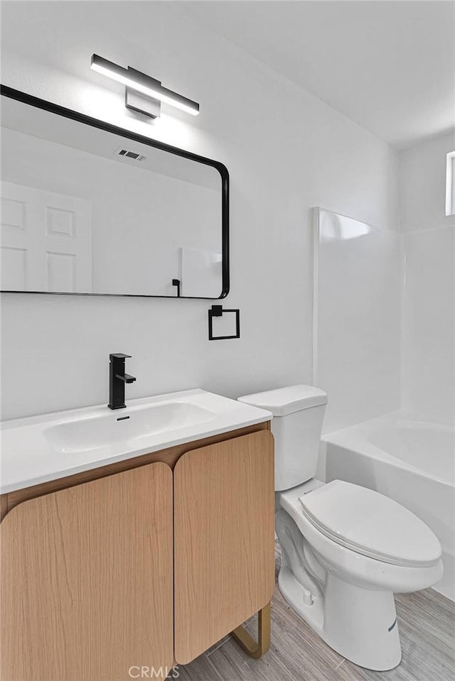 7720 Windsor Ave, Hesperia, CA 92345 - full bathroom featuring vanity and wood finished floors