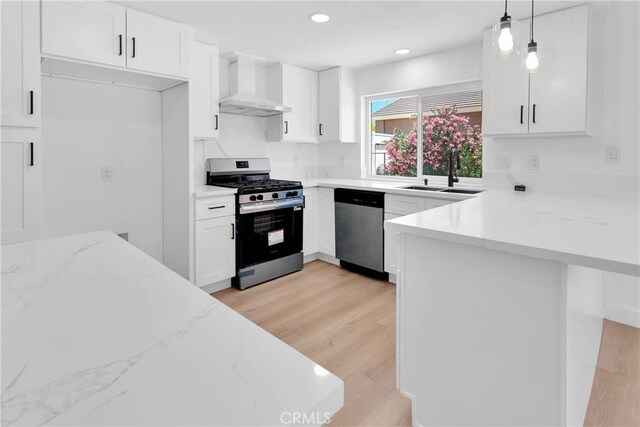 7720 Windsor Ave, Hesperia, CA 92345 - kitchen featuring appliances with stainless steel finishes, wall chimney exhaust hood, a peninsula, white cabinets, and recessed lighting