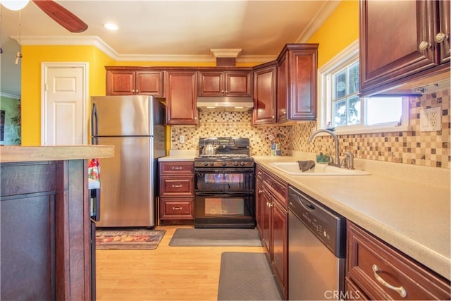 52685 Saddleback Rd, Anza, CA 92539 - kitchen with stainless steel appliances, crown molding, light wood finished floors, light countertops, and backsplash