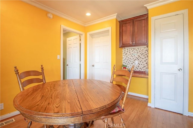 52685 Saddleback Rd, Anza, CA 92539 - dining area featuring light wood-style flooring, ornamental molding, and recessed lighting