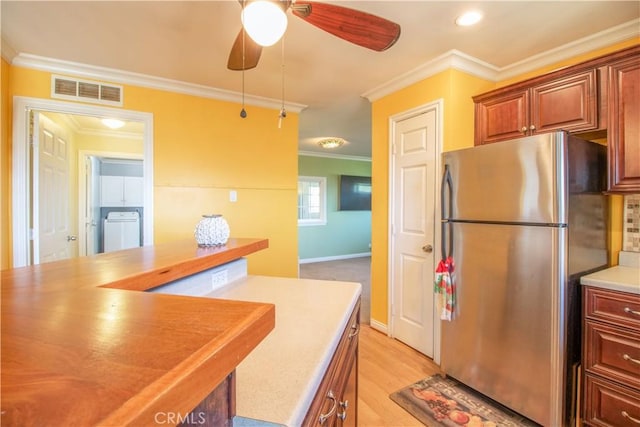 52685 Saddleback Rd, Anza, CA 92539 - kitchen featuring freestanding refrigerator, crown molding, ceiling fan, light wood finished floors, and light countertops