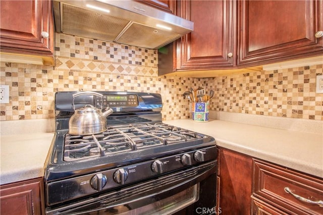 52685 Saddleback Rd, Anza, CA 92539 - kitchen featuring gas stove, exhaust hood, light countertops, and dark brown cabinets
